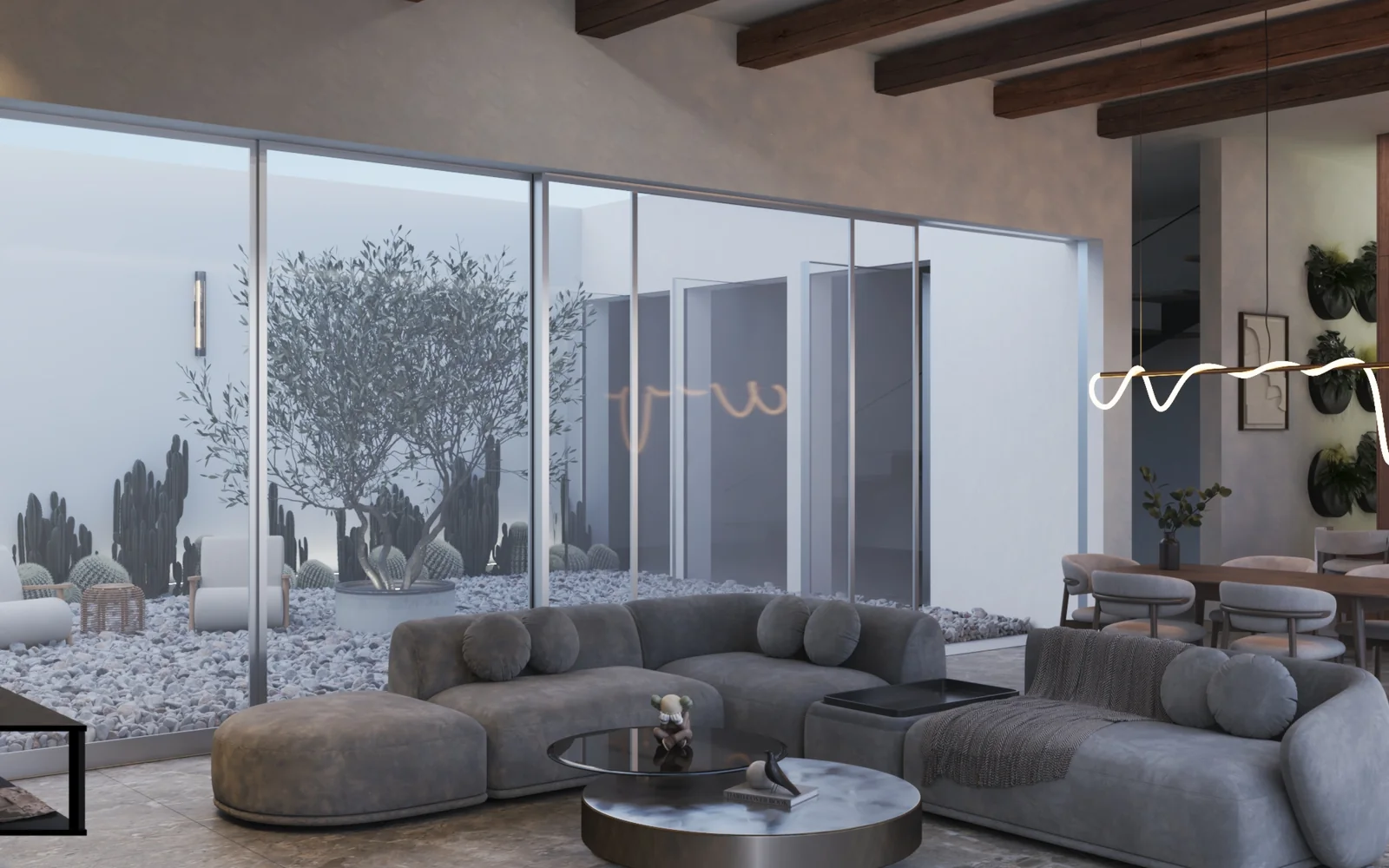 Salón abierto hacia un patio interior con olivo y cerramientos de vidrio