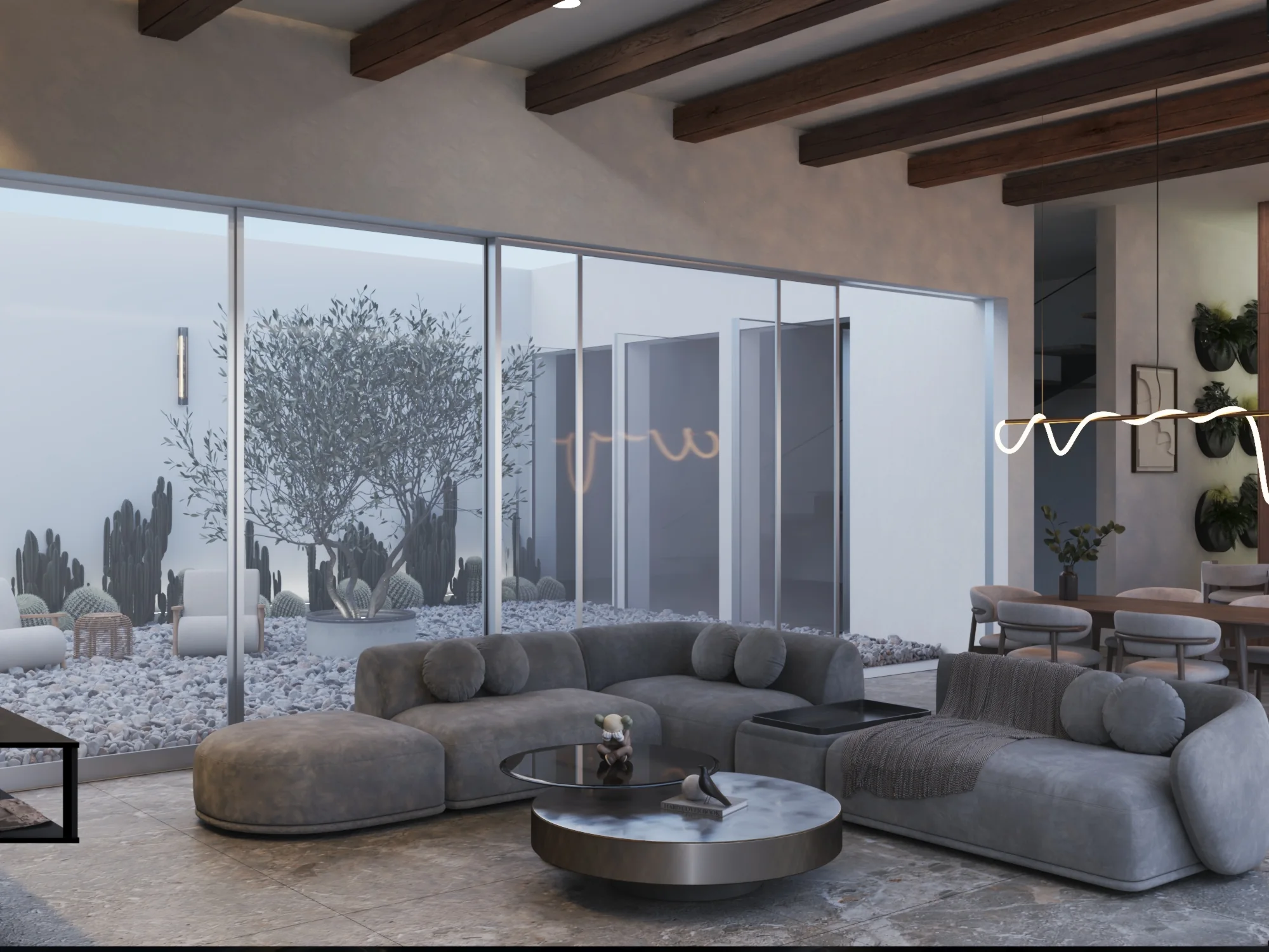 Salón abierto hacia un patio interior con olivo y cerramientos de vidrio