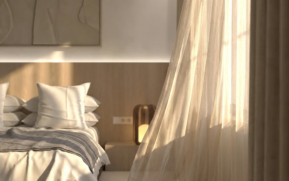 Dormitorio iluminado por el sol a través de una cortina ligera